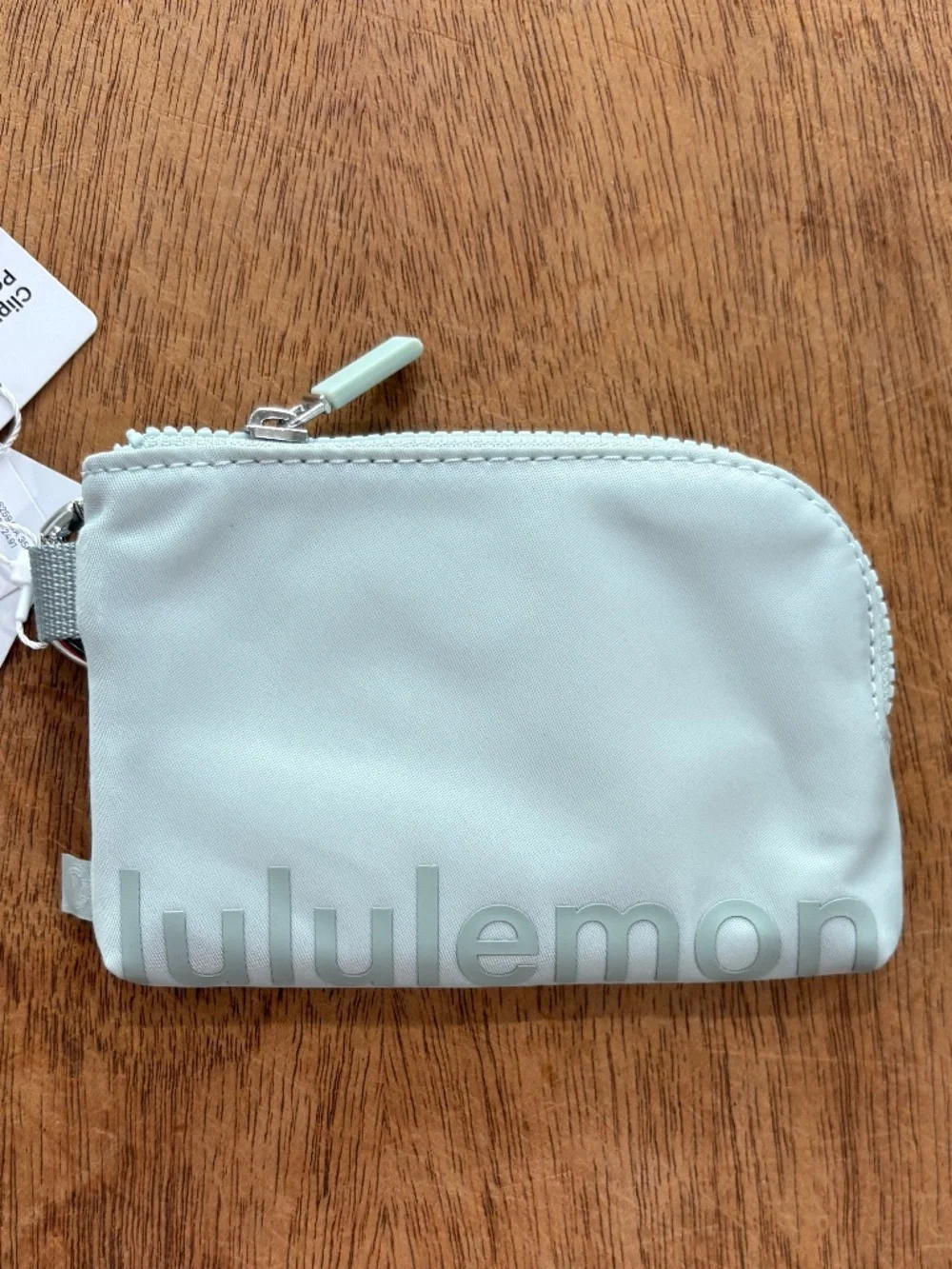 Lululemon clippable card pouch in pelican and Jade Green